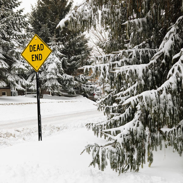 dead end sign in snow representing recruitment freeze